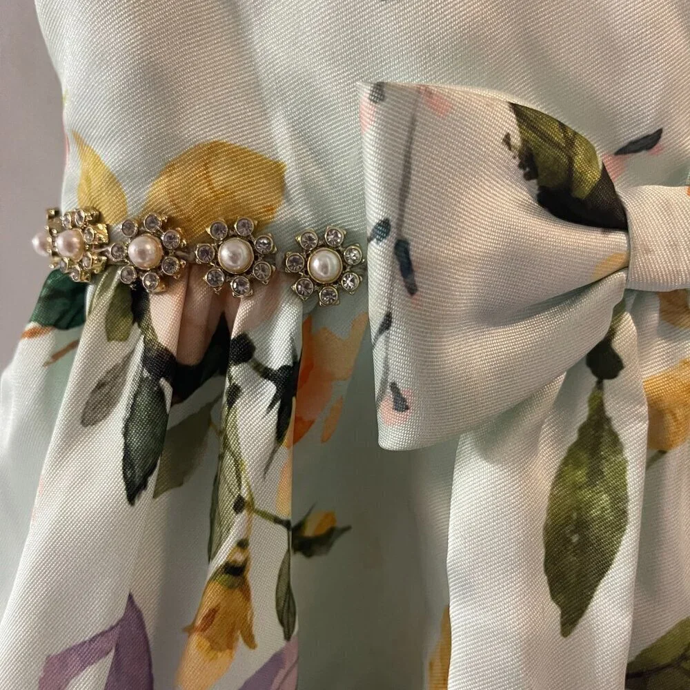 COUTURE PRINCESS. SIZE 6 IN LONG PRINCESS-CUT FLOWERED POLYESTER.